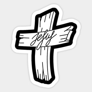 A wooden cross with the inscription Jesus. Sticker